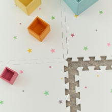 Load image into Gallery viewer, Colourful square blocks on a white surface with star patterns