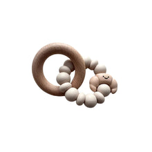 Load image into Gallery viewer, Wooden teething ring with beige beads on a white background