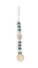 Load image into Gallery viewer, Dummy clip with green beads and a leaf-shaped charm on a white background