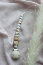 Load image into Gallery viewer, Dummy clip with beads on a pink fabric background