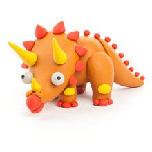 Load image into Gallery viewer, Clay dinosaur with orange body, red spikes, and yellow horns on a white background