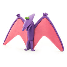 Load image into Gallery viewer, Clay pterodactyl with pink wings and purple body on a white background