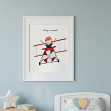 Load image into Gallery viewer, Framed artwork of a child on a red biplane with 'Nothing is impossible' text, on a light blue wall.