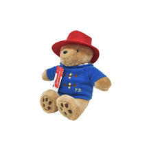 Load image into Gallery viewer, Plush toy bear wearing a red hat and blue shirt with 'P.B.' on a white background
