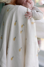 Load image into Gallery viewer, Baby on a womans shoulder with a pear design Ralphie Bear muslin hanging down.