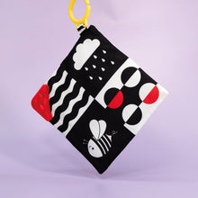 Load image into Gallery viewer, Fabric teether with geometric patterns on a purple background