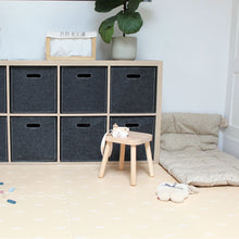 Load image into Gallery viewer, Children's playroom with storage cubes, a small stool, and toys on a light wooden floor.