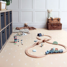 Load image into Gallery viewer, Children's toy train set on a beige floor with storage units and toys in the background.