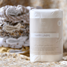 Load image into Gallery viewer, Pack of biodegradable nappy liners with a blurred background