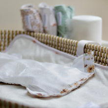 Load image into Gallery viewer, Basket with open cloth nappy on a neutral background