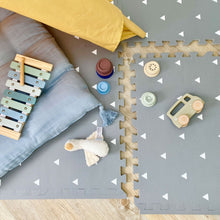 Load image into Gallery viewer, Children's play area with toys on a gray mat with white triangle pattern