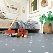 Load image into Gallery viewer, Children's room with toys, a bed, and decorative elements.
