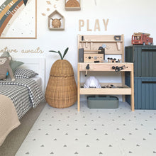 Load image into Gallery viewer, Children's room with a play area, bed, and decorative elements.
