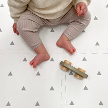 Load image into Gallery viewer, Baby playing with a wooden toy on a patterned play mat