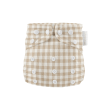 Load image into Gallery viewer, Beige and white checkered cloth nappy with button closures on a white background