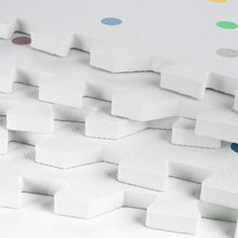 Load image into Gallery viewer, Stack of white foam playmats with colourful polka dot design.