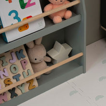 Load image into Gallery viewer, Children's toy shelf with alphabet blocks, stuffed animals, and a number book on cream and sage rainbow floor.