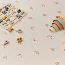 Load image into Gallery viewer, Wooden alphabet puzzle and colorful toy on a light surface with rainbow patterns
