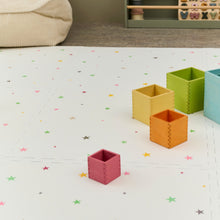 Load image into Gallery viewer, Colorful geometric containers on a white surface with star patterns
