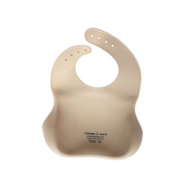 Load image into Gallery viewer, Beige baby bib with brand name on a white background
