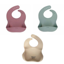 Load image into Gallery viewer, Three baby bibs in pink, green, and beige on a white background
