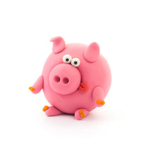 Load image into Gallery viewer, Pink pig made from clay with googly eyes on a white background
