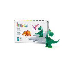Load image into Gallery viewer, Green dinosaur clay figure in front of a 'Hey Clay' packaging box on a white background
