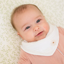 Load image into Gallery viewer, Baby wearing a white bib with daisies pattern on a light patterned blanket
