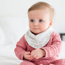 Load image into Gallery viewer, Baby in pink outfit with a white bib with greenery pattern sitting on a white surface
