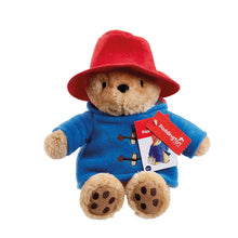 Load image into Gallery viewer, Plush toy bear in a red hat and blue coat with a tag, on a white background
