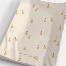 Load image into Gallery viewer, Beige changing mat with yellow pear pattern and 'Ralphie Bear' branding.
