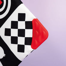Load image into Gallery viewer, Checkered pattern with a red object on a purple background
