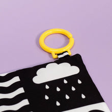 Load image into Gallery viewer, Teething toy with cloud and raindrop pattern on a purple background
