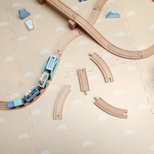 Load image into Gallery viewer, Wooden train set with tracks on a beige surface with rainbow pattern
