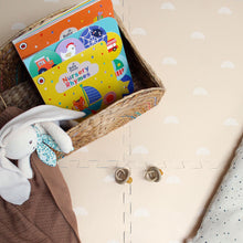 Load image into Gallery viewer, Children's book titled 'Nursery Rhymes' in a basket with a soft toy on a beige surface.

