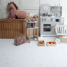 Load image into Gallery viewer, Children's playroom with toys, a wicker basket, and a toy kitchen set.
