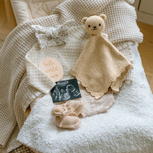 Load image into Gallery viewer, Baby comfort blanket, booties, and teddy bear toy on a textured surface with 'hello world' card.
