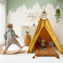 Load image into Gallery viewer, Child playing near a yellow teepee in a room with decorative elements and toys.
