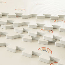 Load image into Gallery viewer, White foam blocks on a light-colored surface with rainbow designs.
