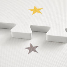 Load image into Gallery viewer, White star-shaped design playmat with yellow and grey stars.
