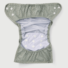 Load image into Gallery viewer, Inside of a sage and white polka dot nappy wrap with white press studs on a white background
