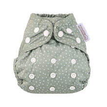 Load image into Gallery viewer, Green cloth nappy with white polka dots and press studs on a white background
