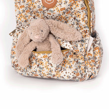 Load image into Gallery viewer, Floral-patterned backpack with a plush rabbit toy inside on a white background
