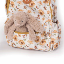 Load image into Gallery viewer, Floral-patterned backpack with a plush toy rabbit inside on a white background
