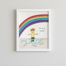 Load image into Gallery viewer, Framed artwork with a child standing on a cloud under a rainbow, with text 'You are my sunshine'.
