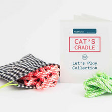 Load image into Gallery viewer, A Me&amp;Mine Cat's Cradle string, with a checkered storage bag, a instructions manual and green string on a white background.
